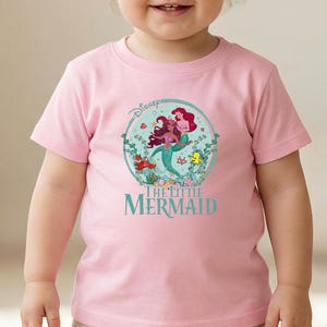 May include: A set of three ceramic mugs with a speckled, matte finish. The mugs are in shades of cream, light gray, and dark gray. Each mug has a simple, minimalist design, perfect for coffee or tea.