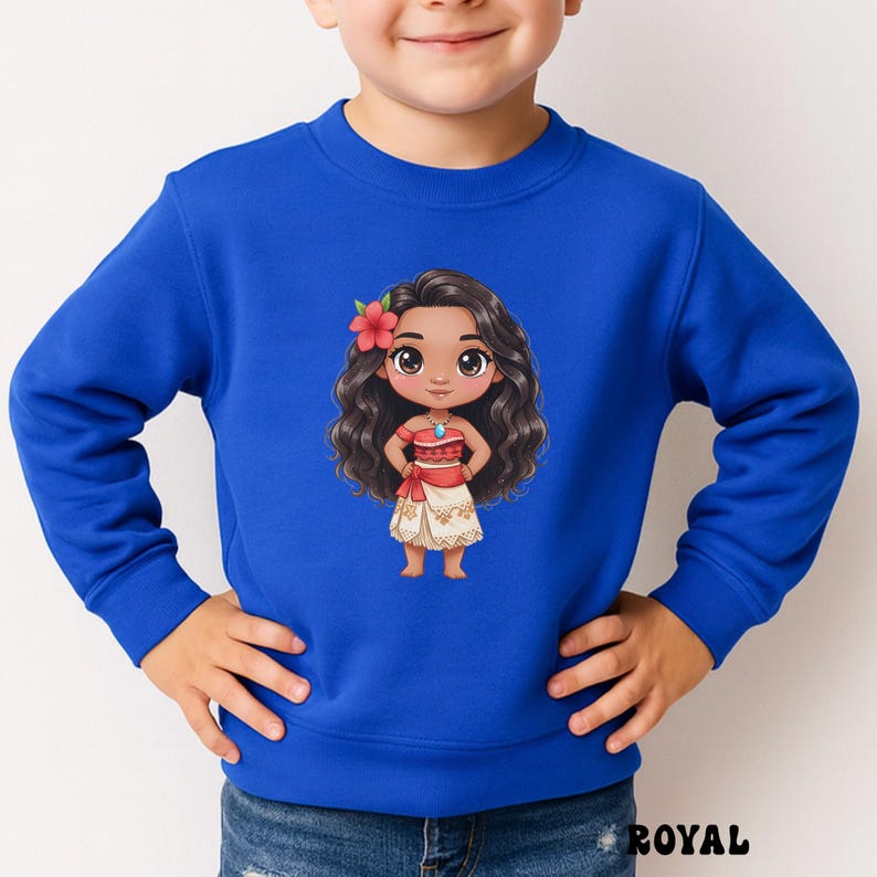 May include: Royal blue sweatshirt featuring a cartoon illustration of a Polynesian girl with long, wavy black hair, a red flower, and a red and white outfit. The word "ROYAL" is printed in black at the bottom right.