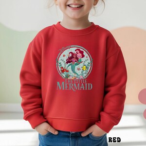 May include: A set of three ceramic mugs with a speckled, matte finish. The mugs are in shades of cream, light gray, and dark gray. Each mug has a simple, minimalist design, perfect for coffee or tea.