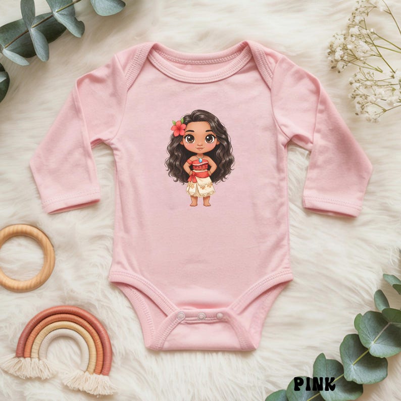 May include: Pink long-sleeved baby bodysuit featuring a cartoon illustration of a girl with dark hair, a red flower, and a red and white outfit. The bodysuit has a round neckline and snap closures. The word "PINK" is printed at the bottom.