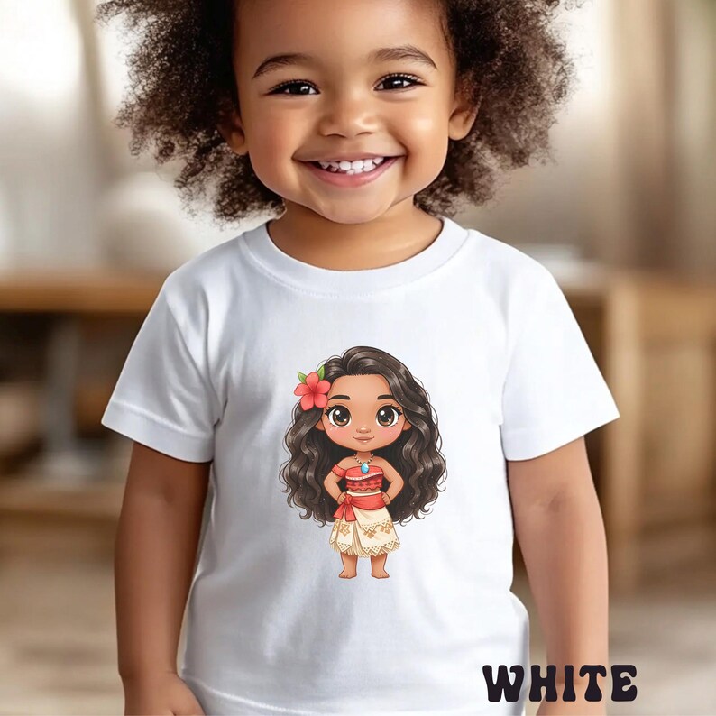 May include: White t-shirt featuring a cartoon illustration of a girl with long, dark hair, a red flower, and a red and white outfit. The word "WHITE" is printed at the bottom of the shirt. The shirt is worn by a child.