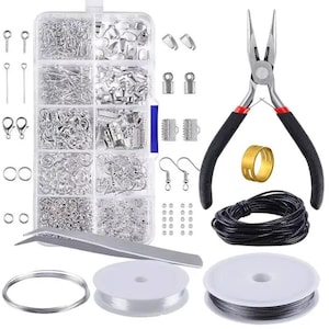 May include: A jewelry-making kit with various silver-colored findings, including jump rings, clasps, and earring hooks. The kit also includes pliers with black handles, a gold-colored ring, black cord, and spools of clear and black wire.