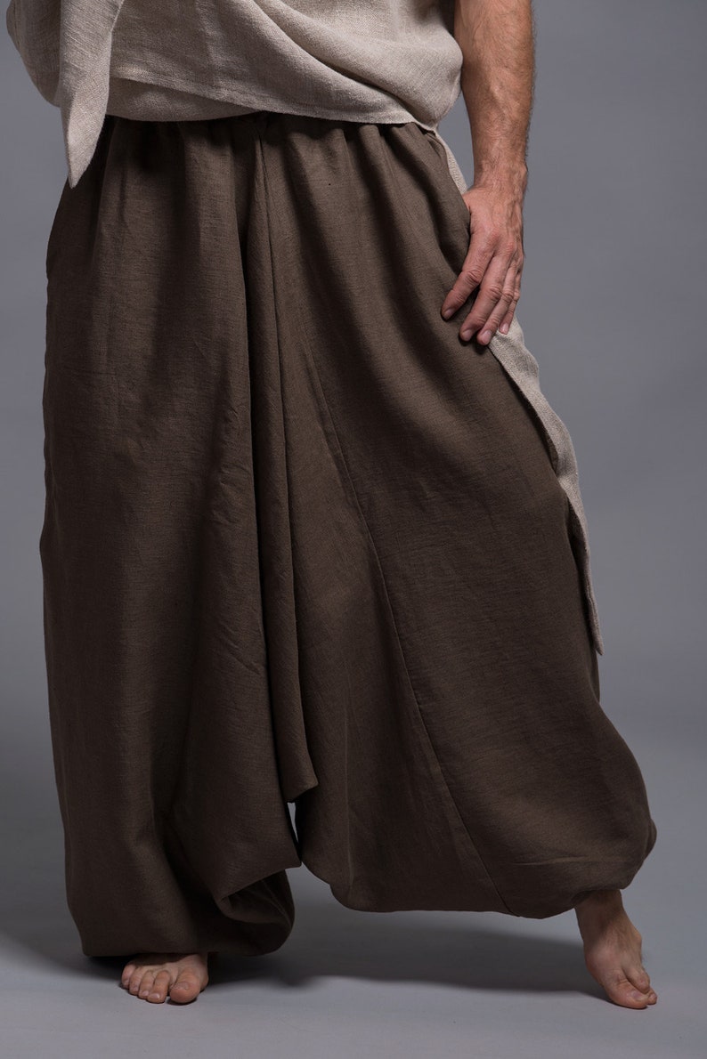 Brown linen pants with a loose, flowing fit. The pants have a wide leg and a gathered waist.