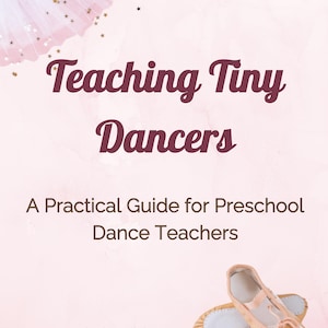 May include: A book cover with the title "Teaching Tiny Dancers" in burgundy script. Below, it reads "A Practical Guide for Preschool Dance Teachers." Two ballet slippers in shades of tan and pink are at the bottom right. The author's name is Melanie Kallai.