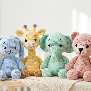 May include: Four handmade crochet stuffed animals: a blue bunny, a yellow giraffe, a mint green elephant, and a pink bear. Each has embroidered facial features and is sitting on a wooden shelf. The toys are made of soft yarn.
