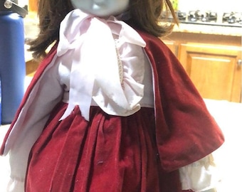Miss red Kaiser collection  porcelain doll with white porcelain face