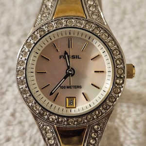 Women&#39;s FOSSIL Rhinestones  gold and silver tone mother of pearl face Watch AM3979-