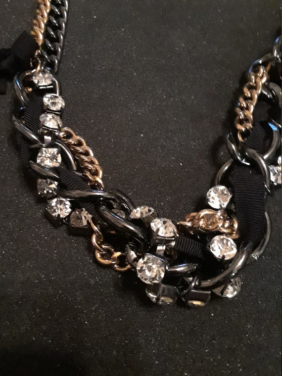 Signed j crew crystal with blak ribbon 