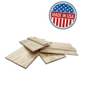 May include: Several unfinished wooden planks are arranged on a white background. The planks are light-colored, possibly pine, and vary in size and shape. A circular emblem with the text "MADE IN USA" is in the upper right corner.