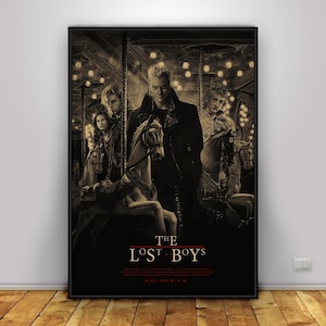 May include: A sepia-toned poster featuring the movie title "The Lost Boys" with a carousel scene. The poster showcases several figures, including one in a black coat, standing near carousel horses. The background includes lights and a carousel.