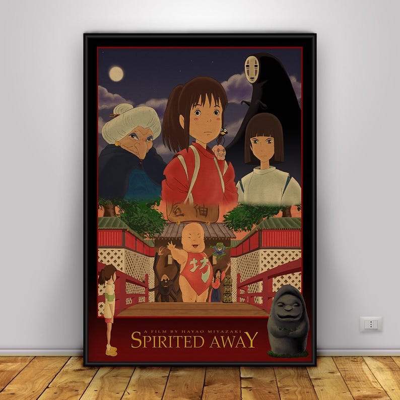 Op de afbeelding: Een ingelijste poster met personages uit de animatiefilm "Spirited Away". De illustratie toont een jong meisje in een rode outfit, samen met andere personages tegen een nachtelijke achtergrond. De titel "Spirited Away" staat onderaan.