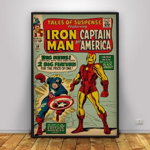 May include: A framed vintage comic book cover featuring Iron Man and Captain America. The cover has a red and yellow color scheme with the text "TALES OF SUSPENSE" and "IRON MAN AND AMERICA". Captain America is shown with his shield, and Iron Man is standing.