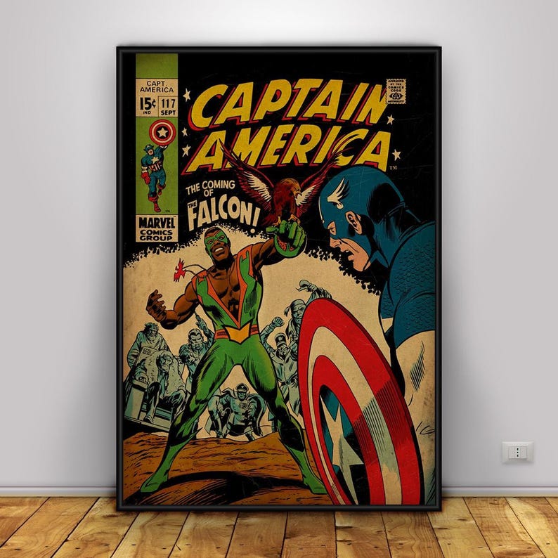 May include: A framed vintage comic book cover featuring Captain America and The Falcon. The artwork showcases a dynamic battle scene with vibrant colors, including red, blue, green, and yellow. The title "Captain America" is prominently displayed.