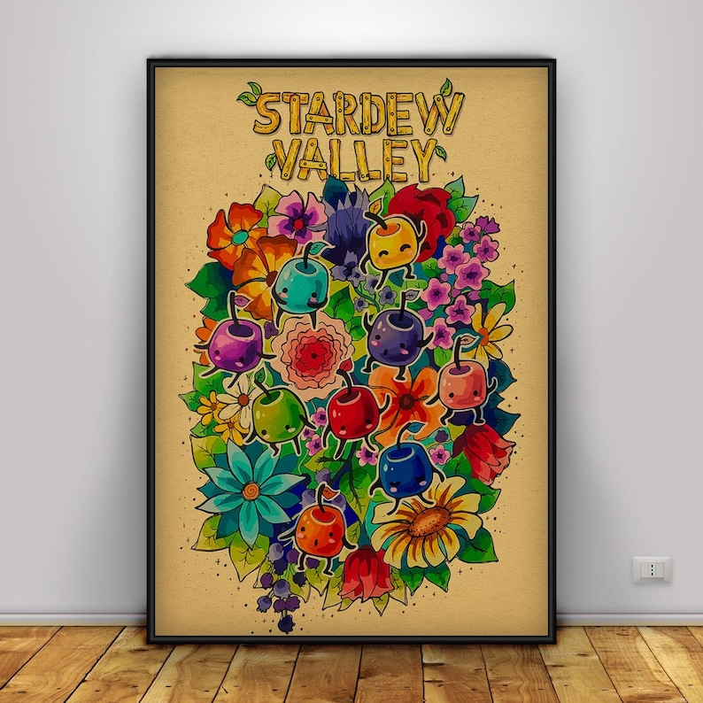 May include: A framed poster featuring the words "Stardew Valley" above a colorful illustration. The artwork showcases a vibrant bouquet of flowers and anthropomorphic fruit characters in various colors, set against a tan background.