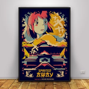 Op de afbeelding: Een ingelijste poster met een gestileerde illustratie uit de animatiefilm "Spirited Away". De afbeelding toont een meisje met roze haar, een traditioneel Japans gebouw en Japanse tekst. De kleuren zijn blauw, geel en rood.