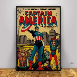 May include: A framed vintage comic book cover featuring Captain America. The cover has a yellow background with the title "CAPTAIN AMERICA" in large red letters. Captain America is in a blue and red costume, holding his shield. The text reads "CAPTAIN AMERICA STRIKES!" and "THE BETRAYERS!"