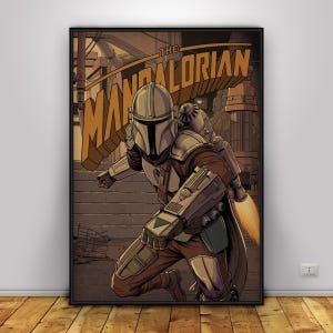 May include: A framed poster with a comic-style illustration of The Mandalorian. The character is shown crouching, wearing detailed armour and a helmet. The poster has a sepia tone, with the title "THE MANDALORIAN" across the top.