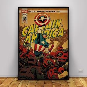 May include: A framed comic book cover featuring Captain America. The artwork shows Captain America in a blue, red, and white costume, raising his arm. The title "CAPTAIN AMERICA" is in large yellow letters. The comic is labeled "MARVEL LEGACY HOME OF THE BRAVE PART 1".