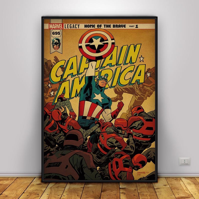 May include: A framed comic book cover featuring Captain America. The artwork shows Captain America in a blue, red, and white costume, raising his arm. The title "CAPTAIN AMERICA" is in large yellow letters. The comic is labeled "MARVEL LEGACY HOME OF THE BRAVE PART 1".
