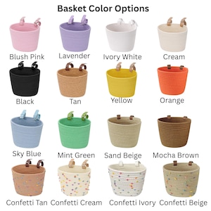 May include: A collection of small, round baskets in various colors, including pink, lavender, white, cream, black, tan, yellow, orange, blue, green, beige, and brown. Some baskets have confetti patterns. The text "Basket Color Options" is at the top.