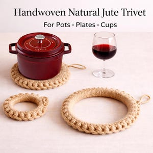 May include: Handwoven natural jute trivets for pots, plates, and cups. The image shows a burgundy pot on a round trivet, a wine glass, and two additional trivets. The trivets are made of woven jute and have a natural, neutral color.
