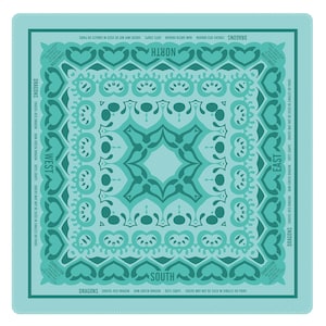 May include: Square bandana in shades of teal and turquoise with a symmetrical design. The design includes heart shapes, swirls, and text indicating directions and phrases like "Dragons" and "Jokers may not be used in singles or pairs."