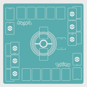 May include: A teal playmat for a card game, featuring a layout with designated areas for cards and game elements. White outlines define card zones, a central game area, and the word "Pok&eacute;mon" in white. The mat is designed for organized gameplay.