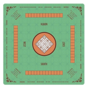 May include: A square Mahjong mat in light green with a repeating geometric pattern. It features four orange tile racks, directional labels for North, South, East, and West, and a central square design with dice icons. Text includes Charleston rules.