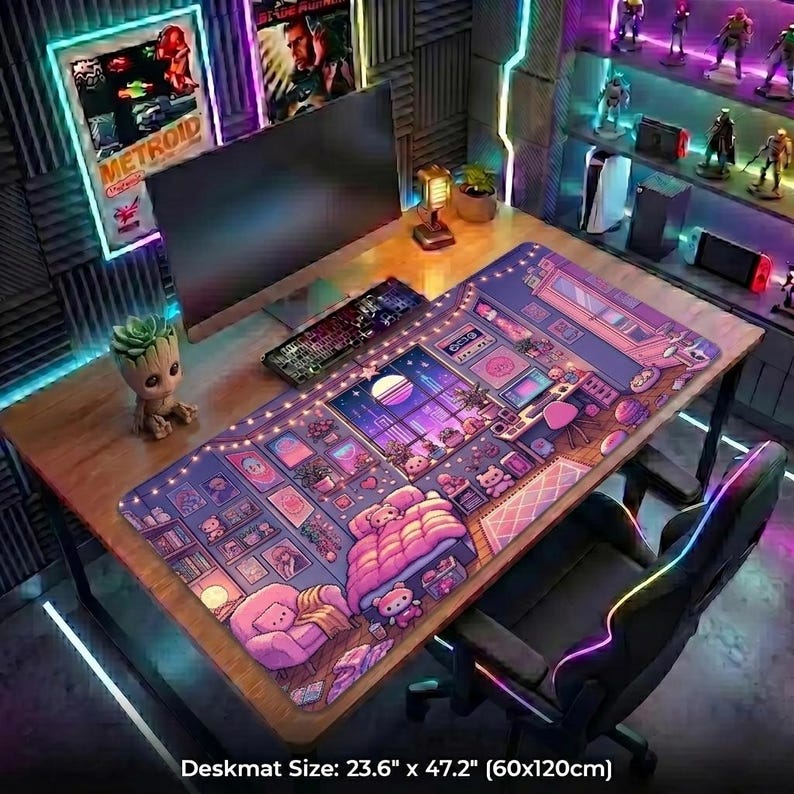 May include: A desk setup featuring a large, colorful deskmat with a cartoon bedroom scene. The desk also has a computer monitor, keyboard, and a small Groot figurine. The deskmat measures 23.6" x 47.2".