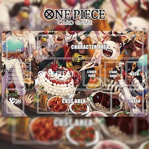 May include: A rectangular playmat for the One Piece card game. The mat features a vibrant, detailed illustration of characters and food items. Designated areas include "Life," "Character Area," "Leader Card," "Stage Card," "Deck," "Cost Area," and "Trash."