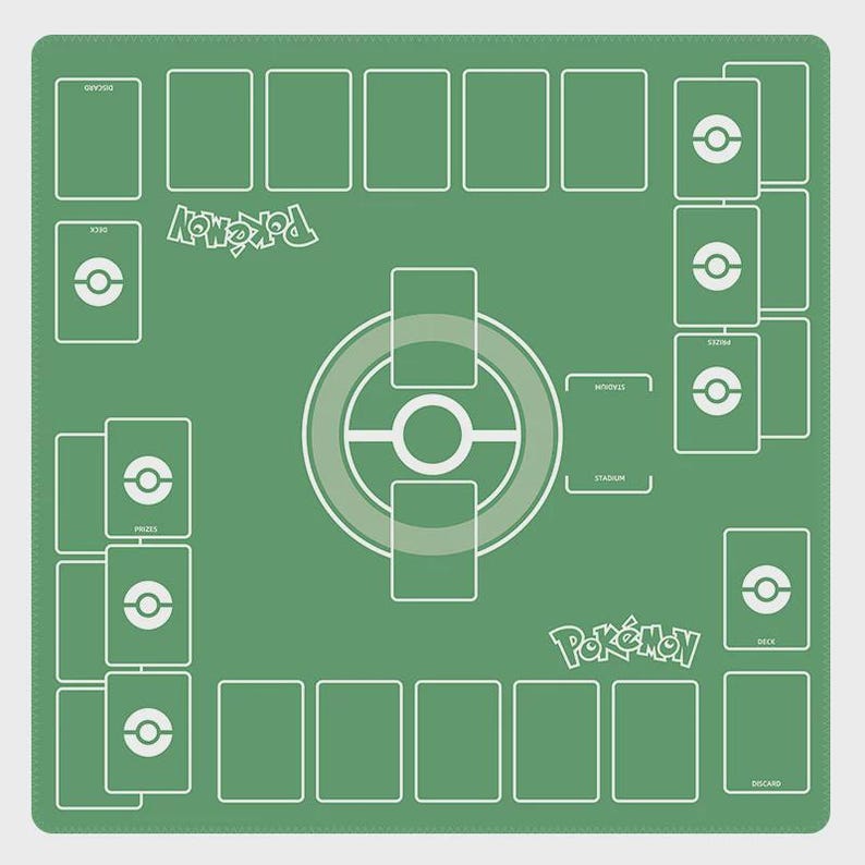 May include: A green Pok&eacute;mon playmat with a white layout for card placement. The mat features the Pok&eacute;mon logo and designated areas for decks, prizes, and other game elements. The mat is square-shaped.
