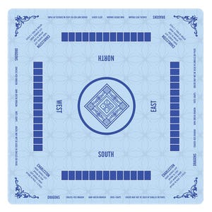 May include: A light blue Mahjong mat featuring a central diamond design with dice pips, four player positions labeled North, South, East, and West, and four tile racks. The mat includes printed Charleston rules and dragon suit terminology.
