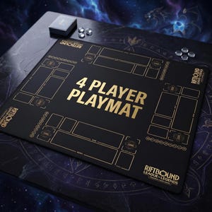 May include: A black 4-player playmat with gold text and accents. The playmat features the text "4 PLAYER PLAYMAT" and the "RIFTBOUND LEAGUE OF LEGENDS TRADING CARD GAME" logo. Dice and a small box are also visible.