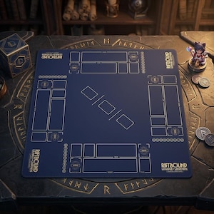 May include: A navy blue Riftbound League of Legends trading card game playmat with gold accents. The mat features designated zones for cards and dice, with the game's logo in the corners. A small figurine and game tokens are also visible.