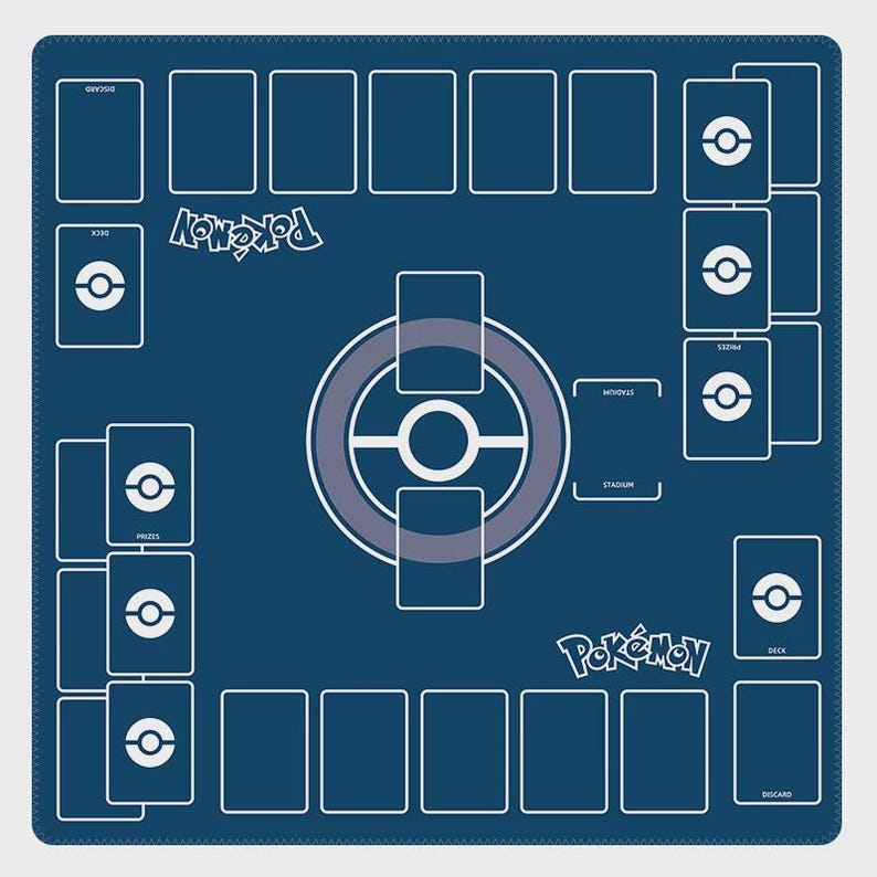 May include: A blue playmat for a card game with a white border. The mat features spaces for cards, a central game area, and the word "Pokemon" in white. The design includes areas for decks, prizes, and a discard pile.