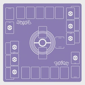 May include: A purple playmat for a card game, featuring a layout with designated areas for cards and game elements. The mat has white outlines and text, including the word "Pok&eacute;mon" and icons. The overall design is symmetrical and organized.
