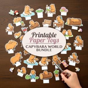 May include: A collection of printable paper toys featuring capybaras in various scenes. The toys include capybaras on a log, using a laptop, and on a donut. The text on the image reads "Printable Paper Toys CAPYBARA WORLD BUNDLE".
