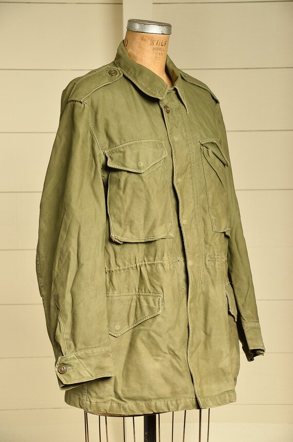 The Story Behind John Lennon s Famous U S Army Jacket