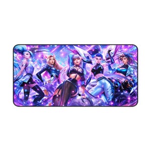 May include: A rectangular desk mat featuring a vibrant digital illustration of five characters in futuristic outfits. The color palette is dominated by shades of neon purple, blue, and pink, with sparkling light effects and a dark, starry background.