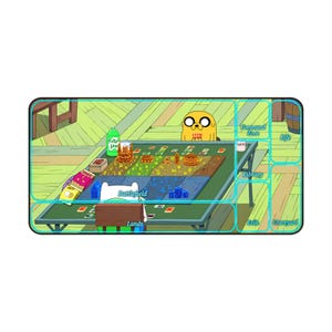 May include: A rectangular playmat featuring an Adventure Time illustration of Finn and Jake playing a card game. The mat includes labeled zones for Battlefield, Lands, Command Zone, Life, Library, Exile, and Graveyard in a light blue font.