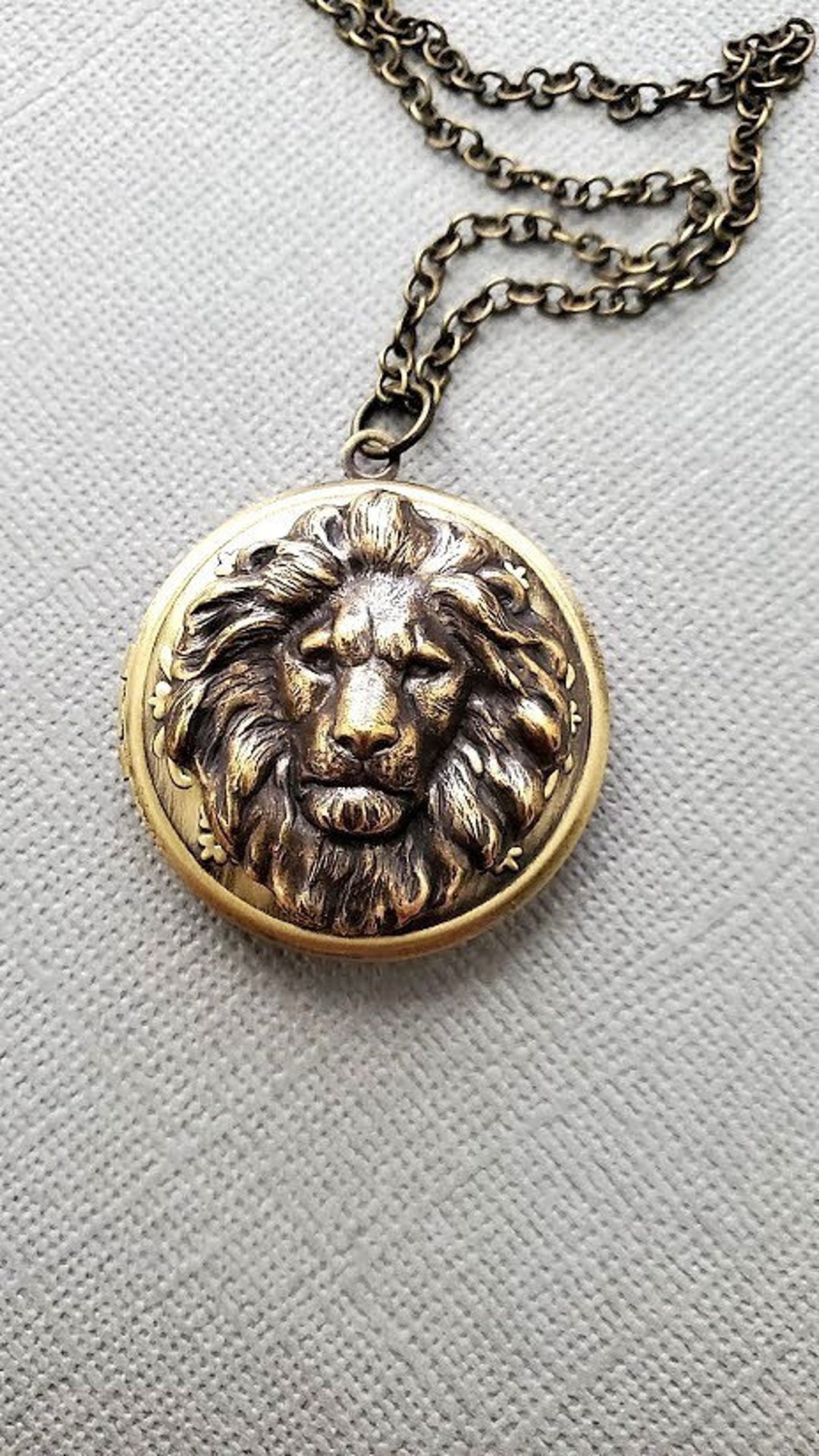 Lion locket discount