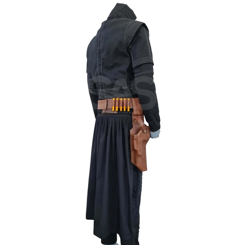 May include: A black hooded jacket with white stitching, paired with a long black skirt. A brown leather belt features a row of yellow-tipped cartridges and a large holster attached to the side, worn over the dark fabric ensemble.