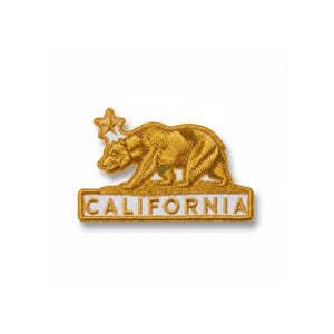 May include: Embroidered patch featuring the California state flag design. The patch depicts a golden bear and a star, with the word "CALIFORNIA" in a white font on a rectangular base. The patch is on a white background.