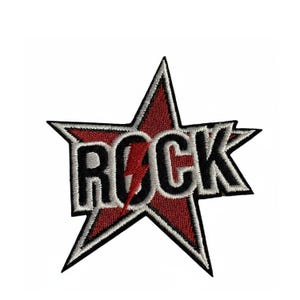 May include: Embroidered patch with a red star design and the word "ROCK" in black, edged with white. A red lightning bolt is inside the letter "O". Suitable for attaching to clothing or accessories.