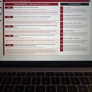 May include: A laptop displaying a document titled "Exam Questions & Top Tips" about food safety. The document includes questions on food-related illnesses, hazards, and allergens. A keyboard is visible in the foreground.
