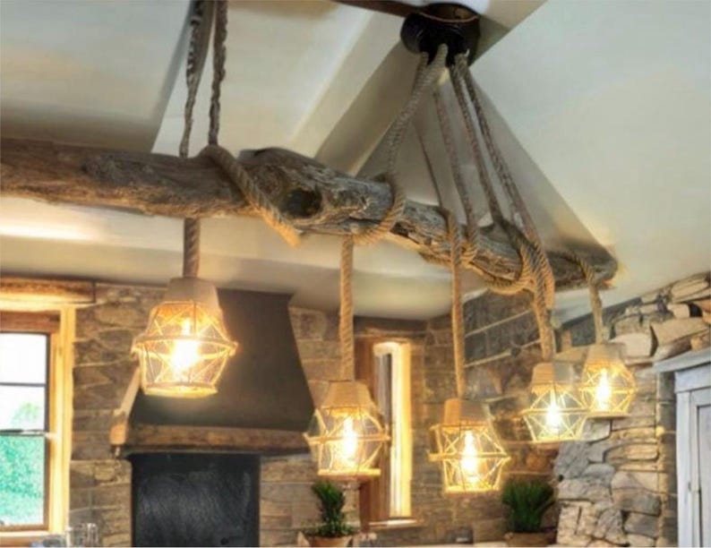 Scottish driftwood rope chandelier lit above a table
