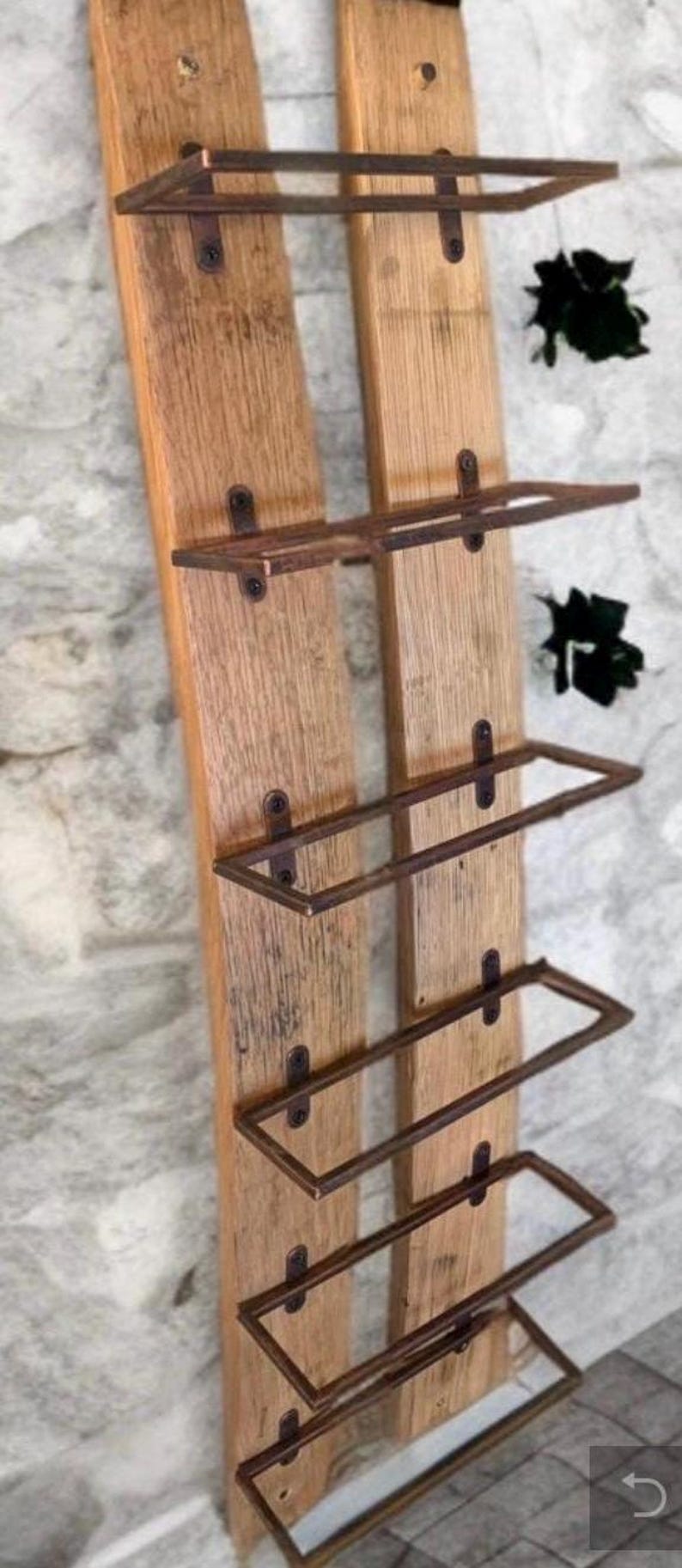 Barrel-stave wine rack mounted on a wall