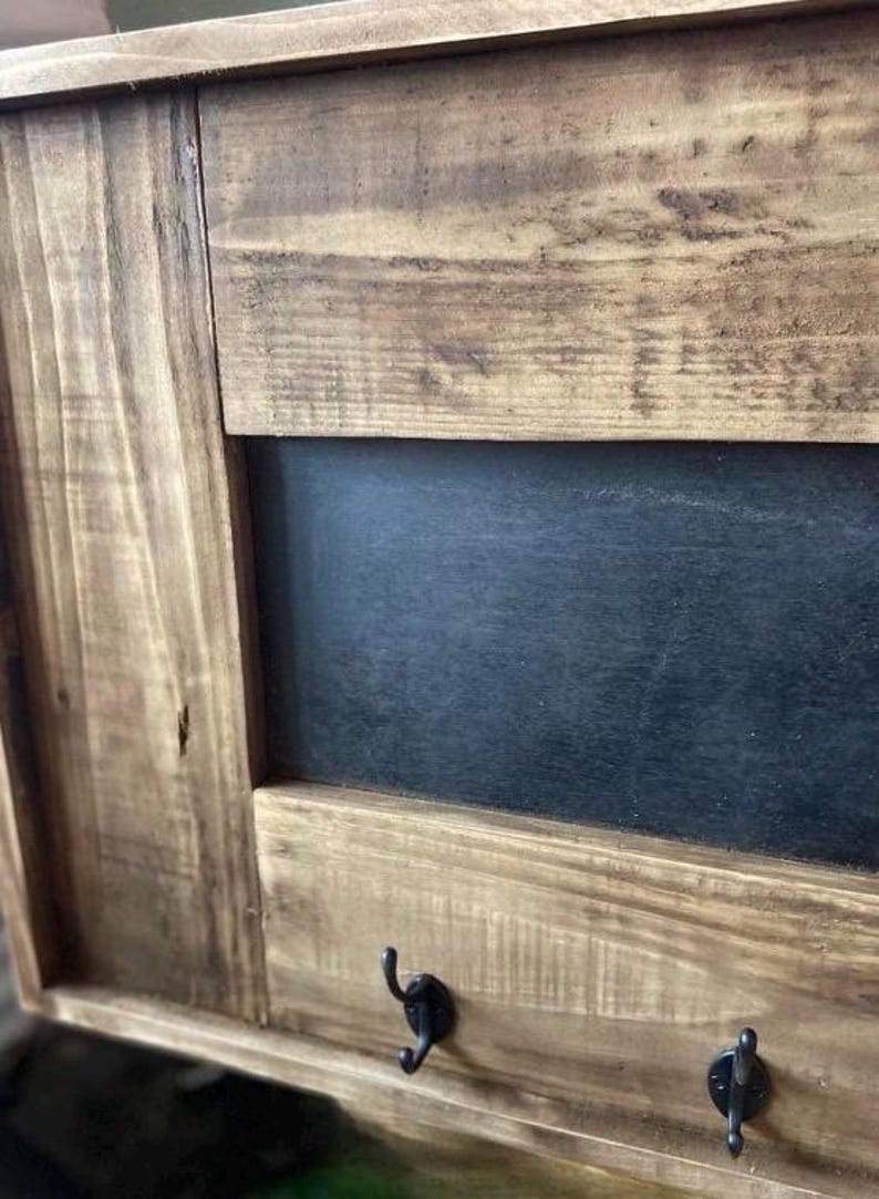Key holder and blackboard mounted in a hallway