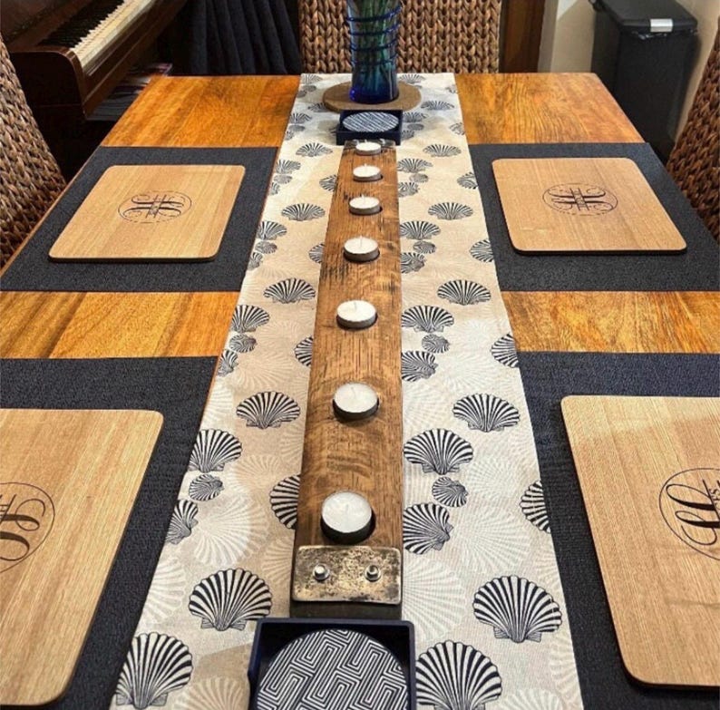 Barrel-stave tea-light centrepiece lit on a table