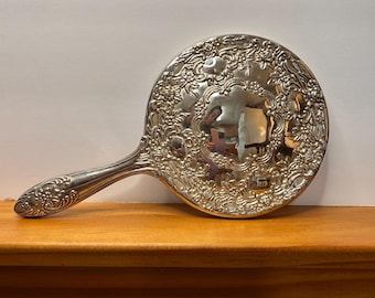 Schwerer Vintage verzierter silberfarbener Handspiegel